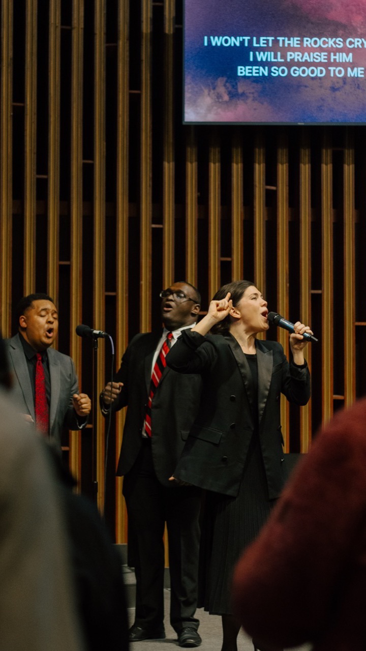 Three worship leaders singing