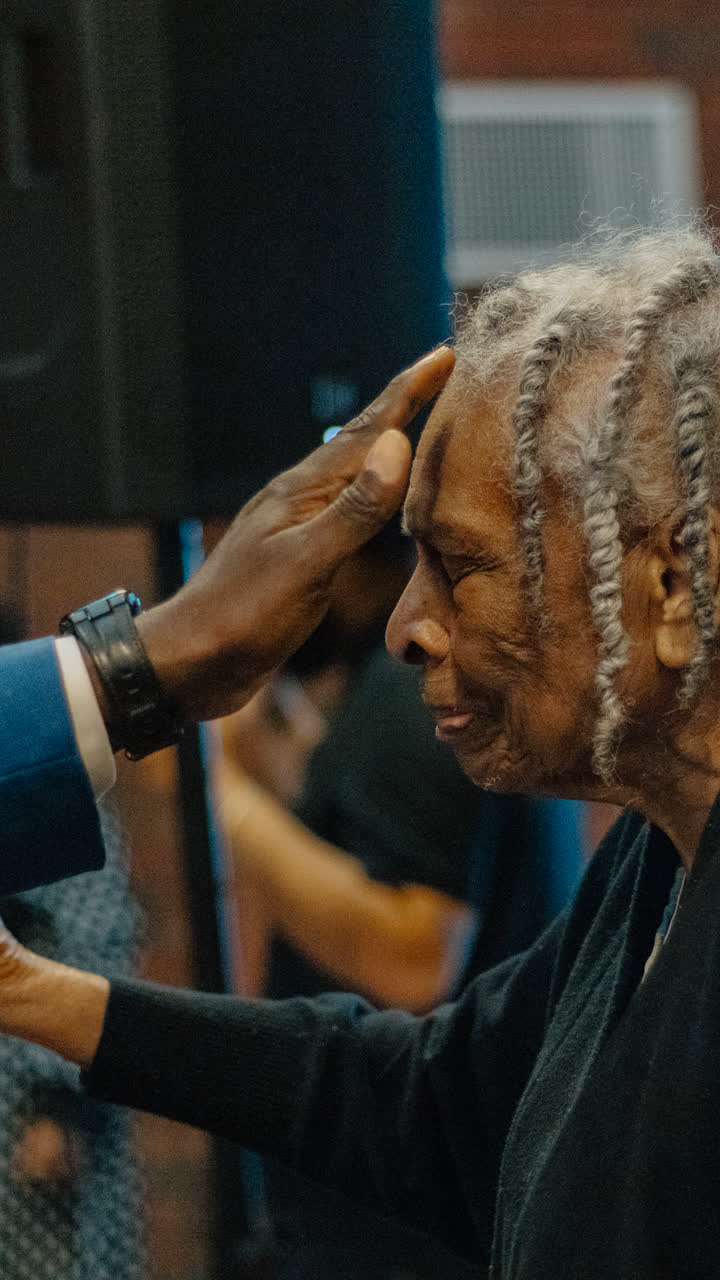 An elder receiving prayer