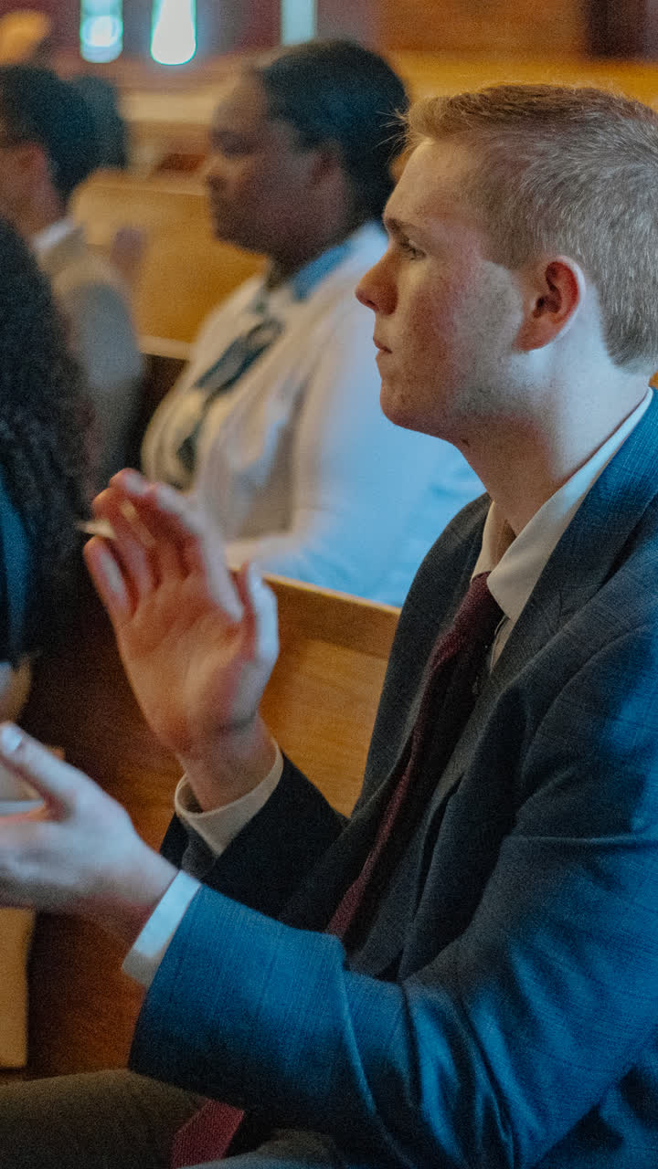 A young man in quiet prayer
